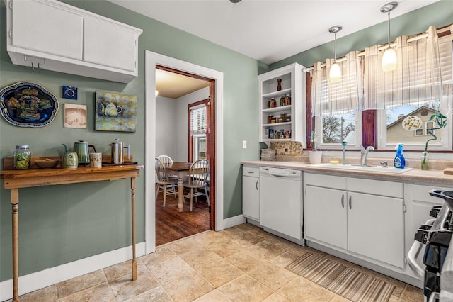 kitchen with sink, range, hanging light fixtures, dishwasher, and white cabinets