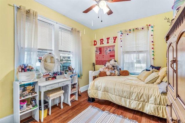 bedroom featuring hardwood / wood-style flooring and ceiling fan