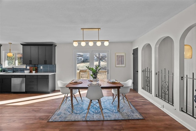 dining space featuring dark wood finished floors