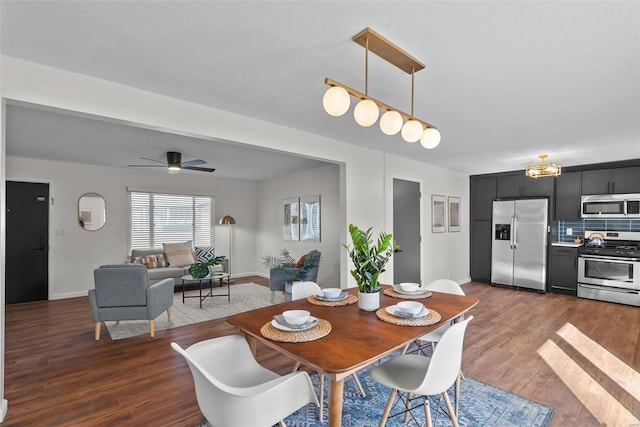 dining room featuring a ceiling fan, dark wood finished floors, and baseboards