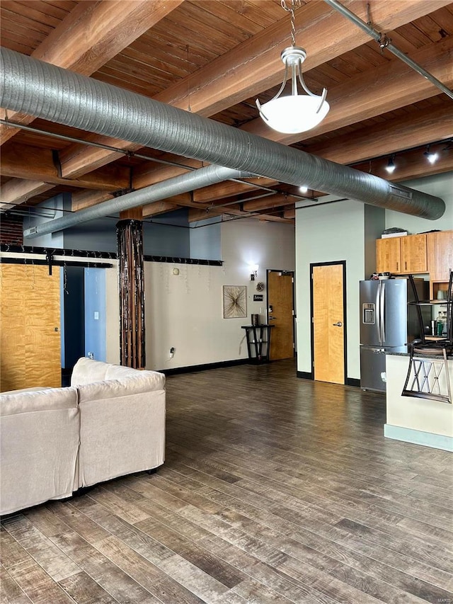 unfurnished living room featuring dark hardwood / wood-style flooring