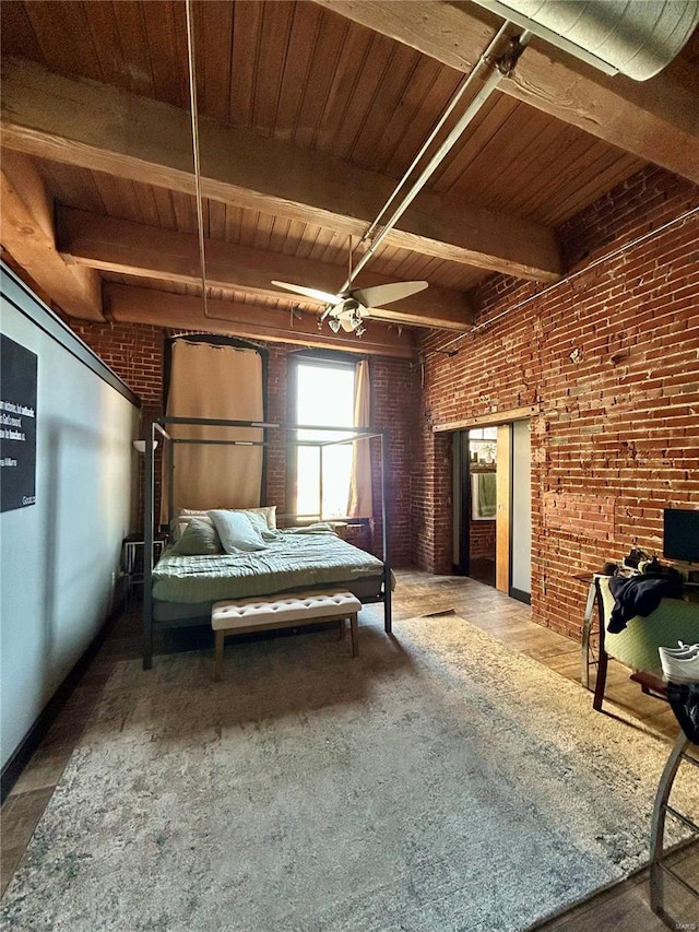 bedroom featuring ceiling fan, wooden ceiling, beamed ceiling, and brick wall