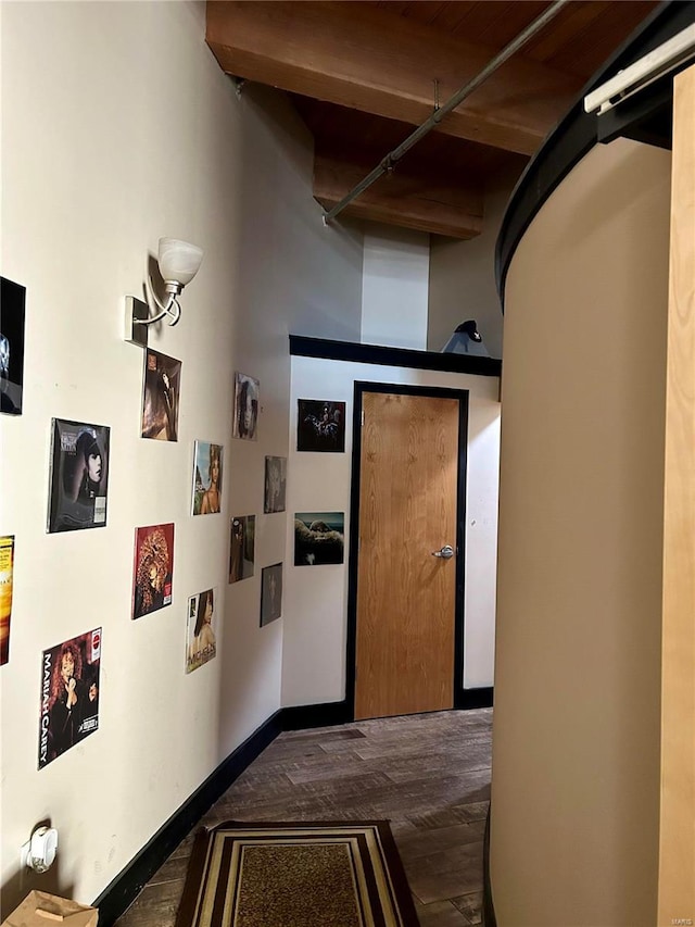 hall with dark hardwood / wood-style flooring