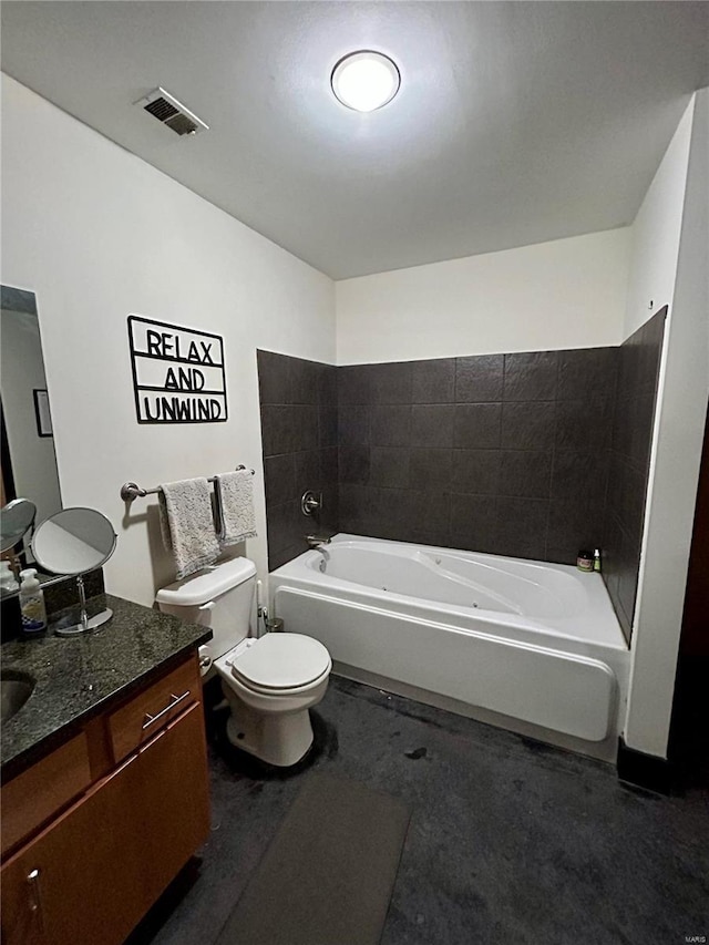 bathroom featuring a bathing tub, vanity, and toilet