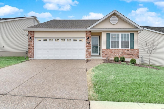 view of front of house with a garage and a front yard