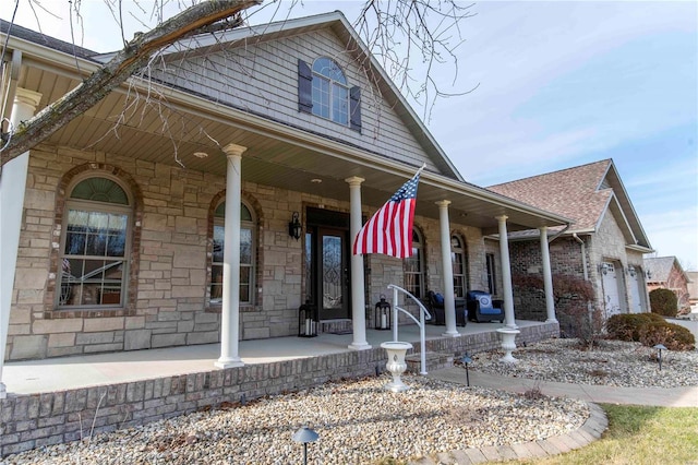 view of front of property with a garage and a porch