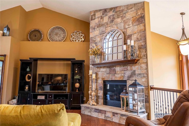 living room with lofted ceiling, hardwood / wood-style flooring, and a fireplace