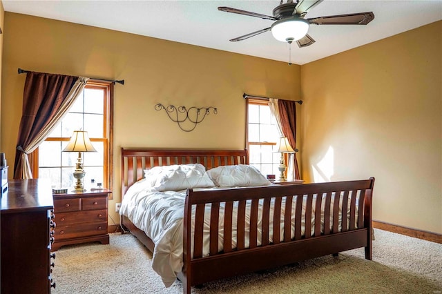 bedroom featuring ceiling fan and light colored carpet