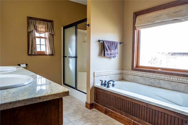 bathroom featuring vanity, tile patterned flooring, and shower with separate bathtub