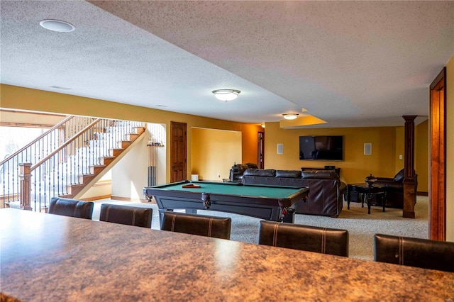 rec room featuring decorative columns, carpet, pool table, and a textured ceiling