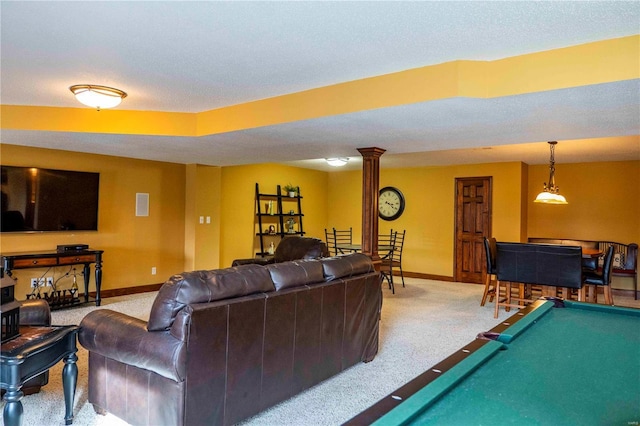 carpeted living room with pool table and ornate columns