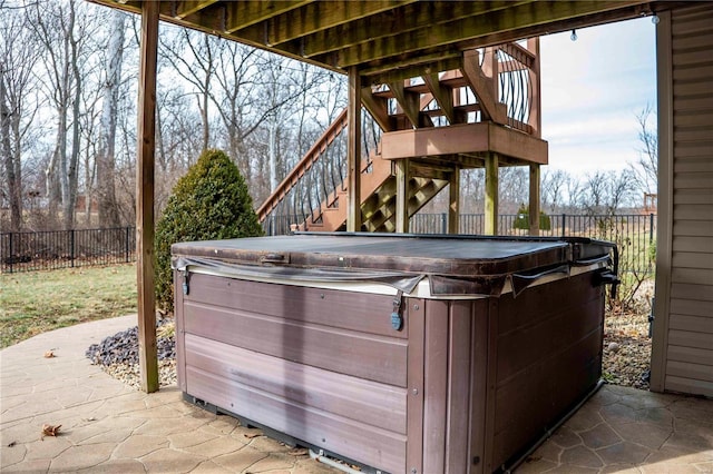 view of patio / terrace with a hot tub