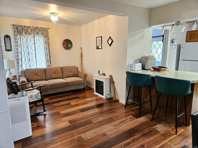 living room with dark hardwood / wood-style floors