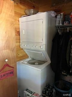 clothes washing area with stacked washer / drying machine