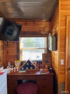 home office with wood walls