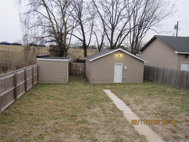 view of outbuilding featuring a lawn