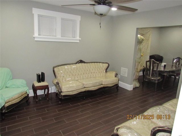 living area with ceiling fan