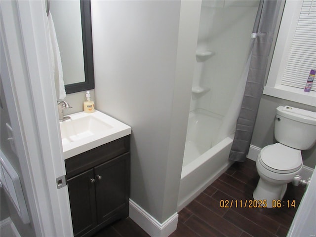 full bathroom with toilet, vanity, and shower / bath combo with shower curtain