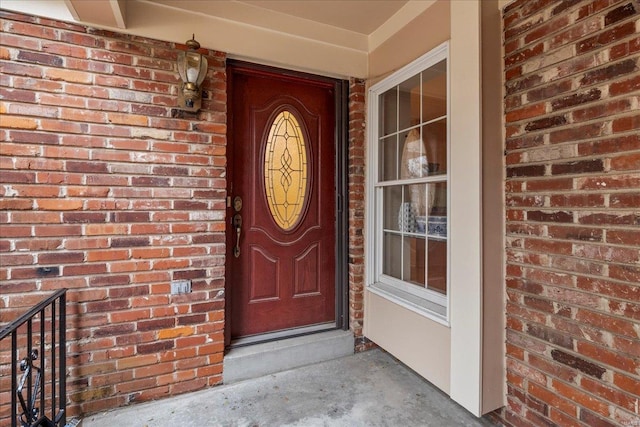 entrance to property with brick siding