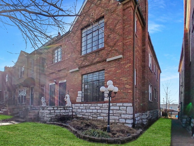 view of home's exterior with a lawn