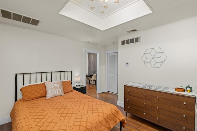 bedroom featuring dark hardwood / wood-style flooring