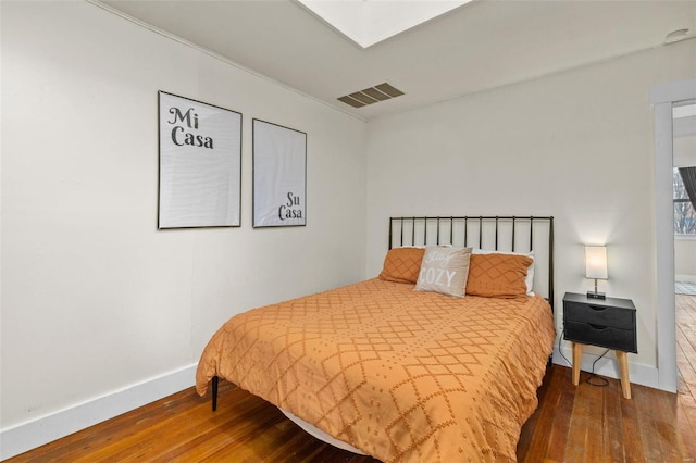 bedroom featuring hardwood / wood-style flooring