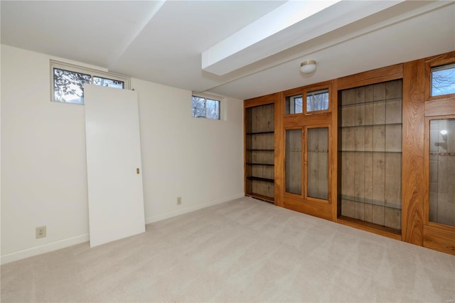 basement featuring carpet and baseboards