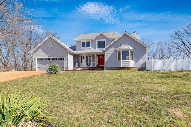 traditional home featuring a front yard, fence, a porch, a chimney, and a garage