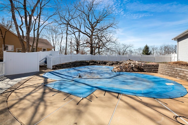 view of swimming pool with a patio, a fenced backyard, and a fenced in pool