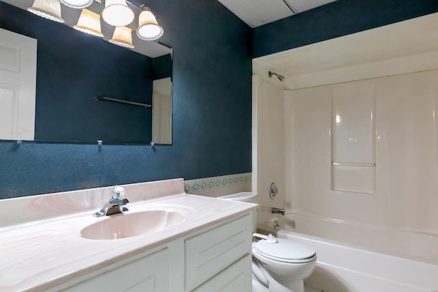 bathroom featuring bathtub / shower combination, toilet, and vanity