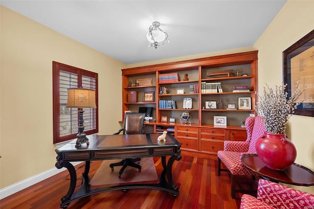 office area featuring dark wood-style floors and baseboards