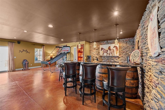 bar featuring recessed lighting, baseboards, finished concrete flooring, stairs, and a dry bar