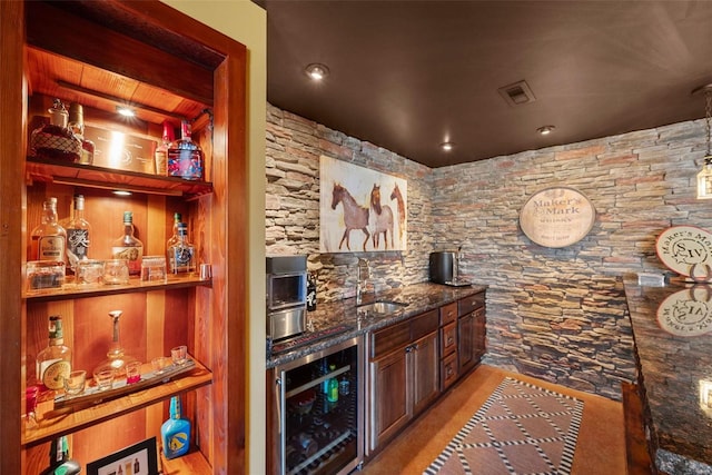 bar featuring a bar, wine cooler, visible vents, and a sink