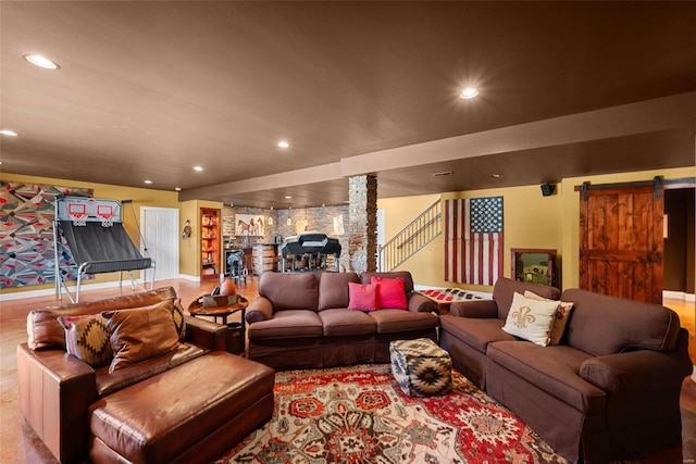 living room with recessed lighting, stairway, and a barn door