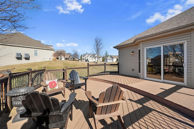 wooden deck featuring a residential view