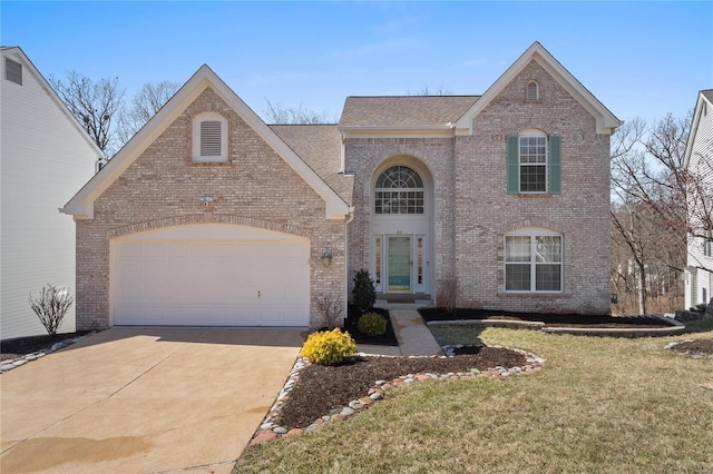 traditional-style home with a front lawn, roof with shingles, concrete driveway, a garage, and brick siding