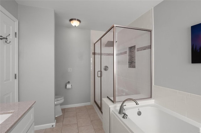 full bath featuring a garden tub, toilet, a stall shower, tile patterned flooring, and vanity