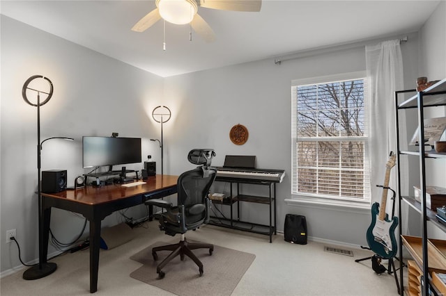 home office featuring carpet, baseboards, visible vents, and ceiling fan