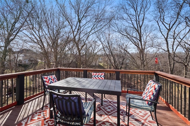 deck with outdoor dining area