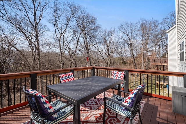 deck featuring outdoor dining area