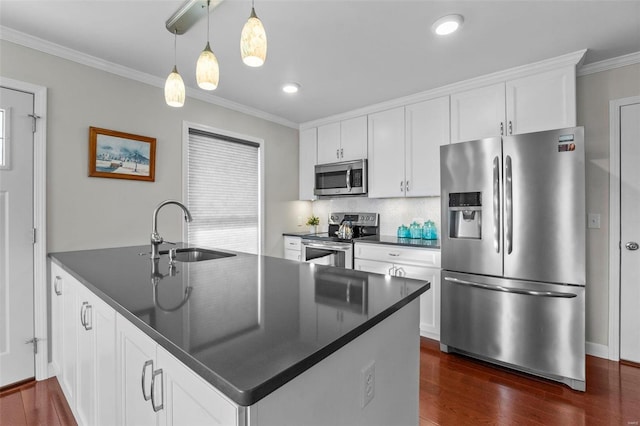 kitchen with sink, ornamental molding, pendant lighting, stainless steel appliances, and white cabinets