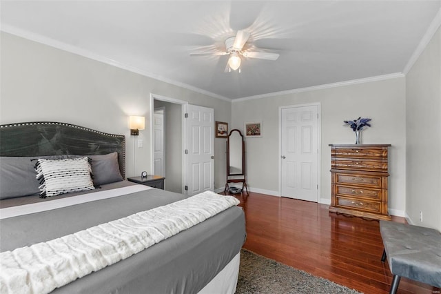 bedroom featuring dark wood-type flooring, ornamental molding, and ceiling fan