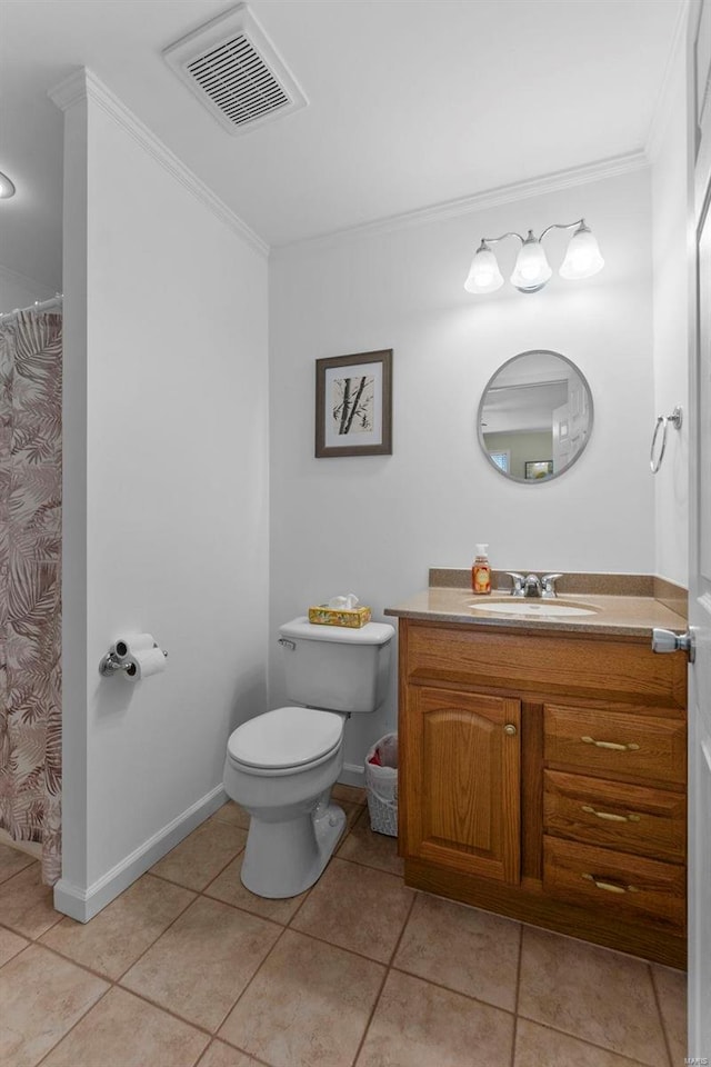 bathroom with tile patterned flooring, vanity, crown molding, and toilet