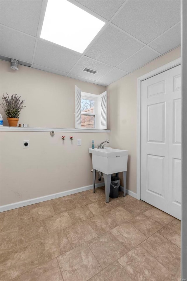 clothes washing area featuring hookup for an electric dryer