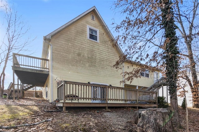 back of property featuring a deck