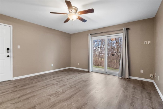 spare room with ceiling fan and light hardwood / wood-style flooring