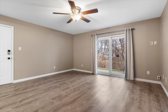 unfurnished room featuring light hardwood / wood-style floors and ceiling fan