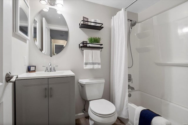 full bathroom featuring shower / bath combination with curtain, vanity, and toilet