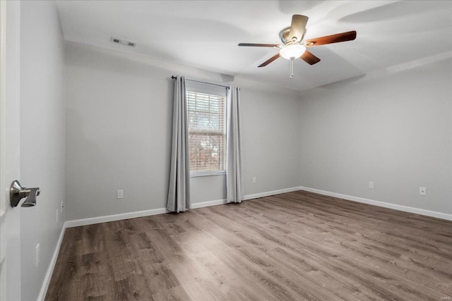 empty room featuring ceiling fan and wood-type flooring