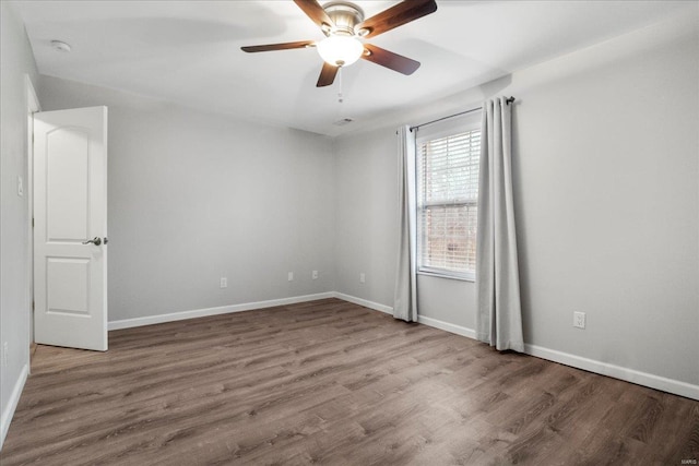 empty room featuring ceiling fan and wood-type flooring